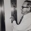 Male pressing elevator buttons