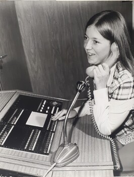 Female working on a switchboard