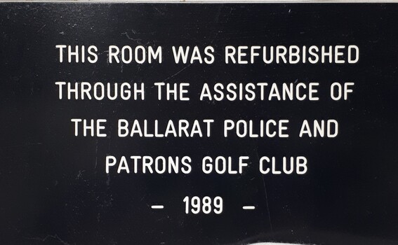 Metal plaque with dedication inscription