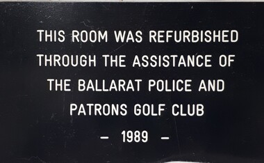 Metal plaque with dedication inscription