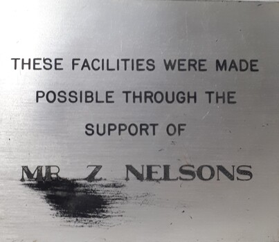 Metal plaque with dedication inscription