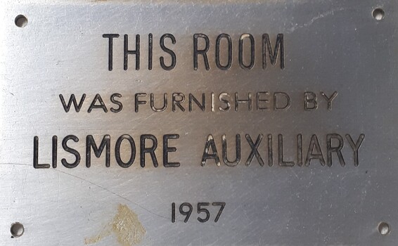 Metal plaque with dedication inscription