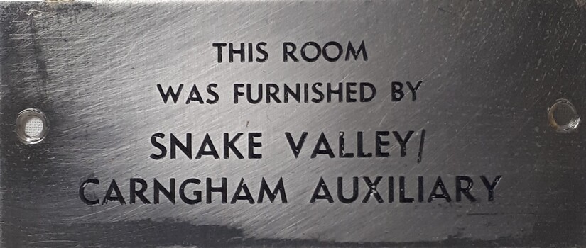 Metal plaque with dedication inscription