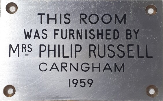 Metal plaque with dedication inscription