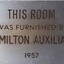 Metal plaque with dedication inscription