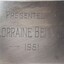 Metal plaque with dedication inscription