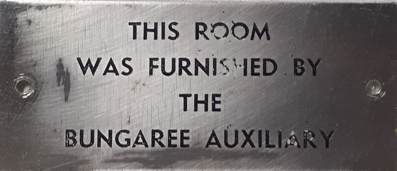 Metal plaque with dedication inscription