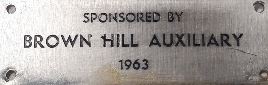 Metal plaque with dedication inscription