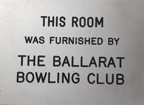Metal plaque with dedication inscription