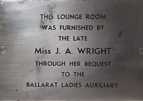 Metal plaque with dedication inscription