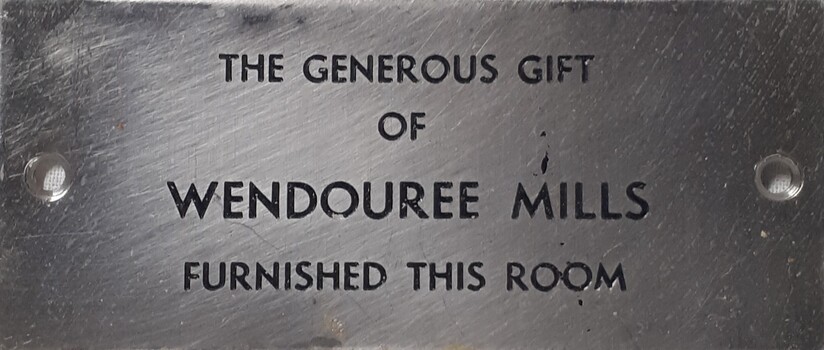 Metal plaque with dedication inscription