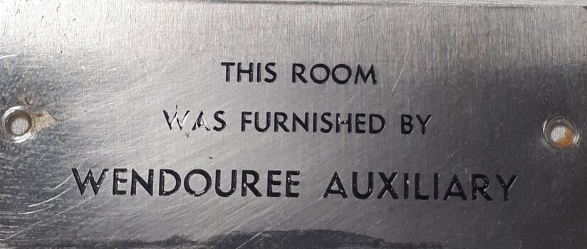 Metal plaque with dedication inscription