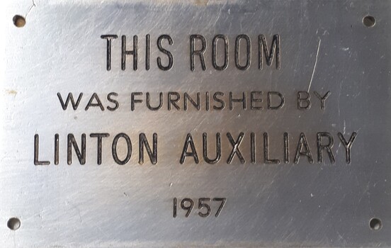Metal plaque with dedication inscription