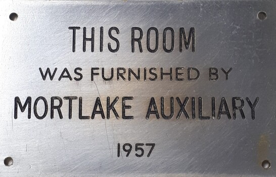 Metal plaque with dedication inscription