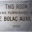 Metal plaque with dedication inscription
