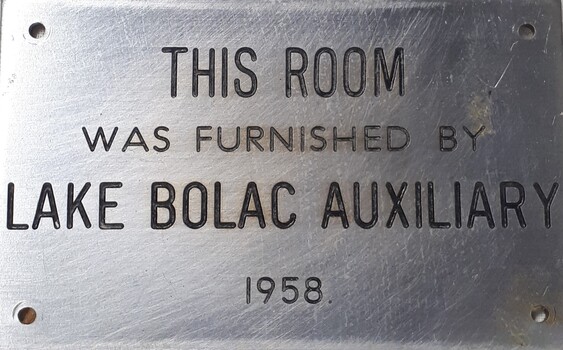 Metal plaque with dedication inscription