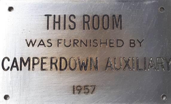 Metal plaque with dedication inscription