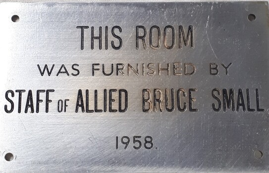 Metal plaque with dedication inscription