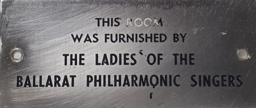Metal plaque with dedication inscription