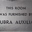 Metal plaque with dedication inscription