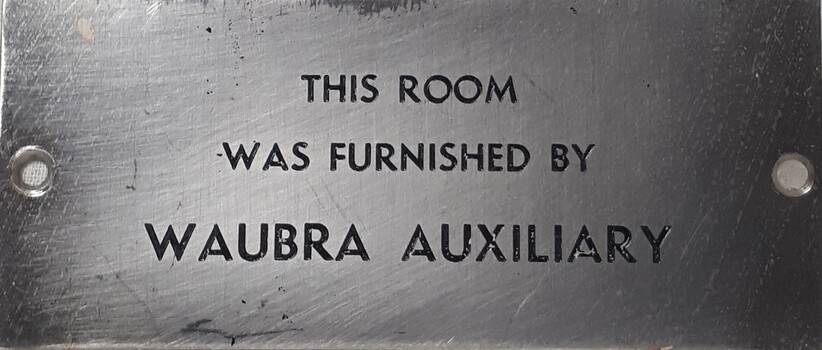 Metal plaque with dedication inscription