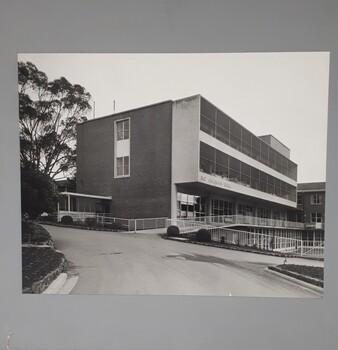 Three storey building with ramps and balconies