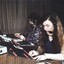 Woman on switchboard using a device to check extension numbers