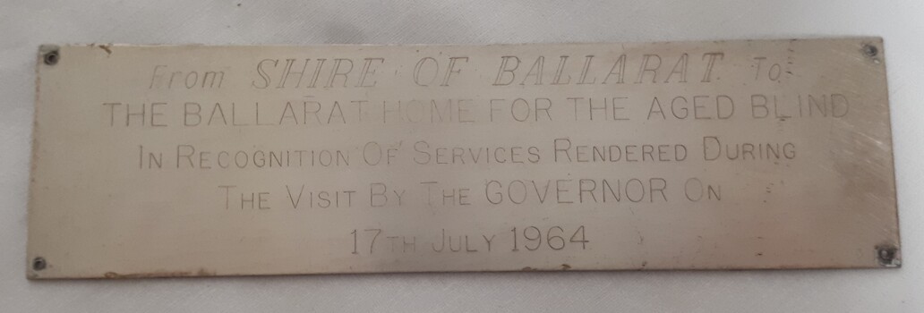 Metal silver looking plaque with engraving