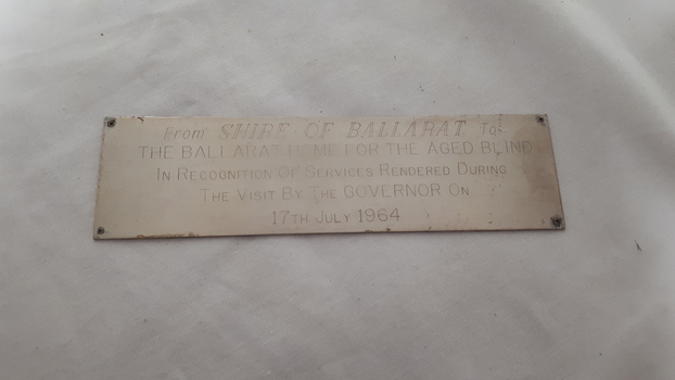 Metal silver looking plaque with engraving