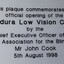 Silver plastic plaque with black writing