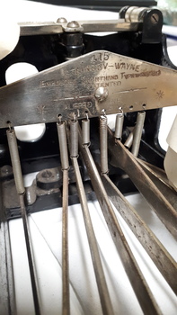 Steel plate on typewriter with name and manufacturer information