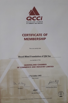 Paper certificate with black and maroon writing