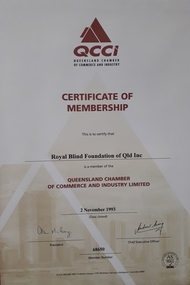 Paper certificate with black and maroon writing
