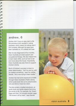 Young boy (Andrew) leaning on a large inflated yellow ball