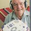 Bruce Scotland holds a Plextor Daisy player which allows him to listen to talking books