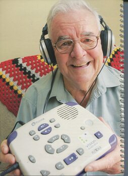 Bruce Scotland holds a Plextor Daisy player which allows him to listen to talking books