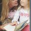 Natalija Lamber and mum Meri-Jade with a braille picture book