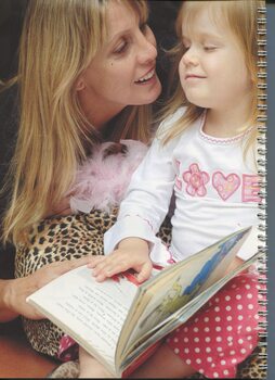 Natalija Lamber and mum Meri-Jade with a braille picture book