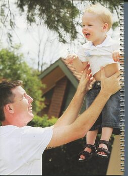 Cooper Hallcroft held by his father Aaron in Wagga Wagga