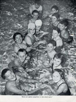 Photograph of blind and sighted swimmers in the pool during inter-school sports