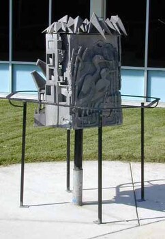Metal sculpture showing sides depicting Decay, Ruin and Harmony