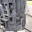 Boxes with broken doors and unfinished concrete depict 'Decay' and a church with a Calvary cross over roughened surface is 'Renewal'.  Both have white and black signs with writing and Braille.