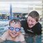 Schoolboy Tyson swimming in Bendigo pool with swim instructor
