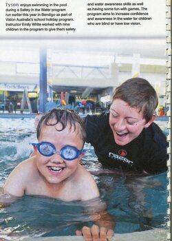 Schoolboy Tyson swimming in Bendigo pool with swim instructor