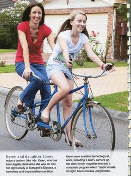 A mother, Karen, and daughter, Ebony, ride a tandem cycle on a suburban street