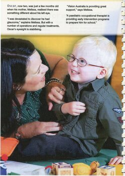 Young boy, Oscar, touches his shirt buttons as his mother Melissa tickles him