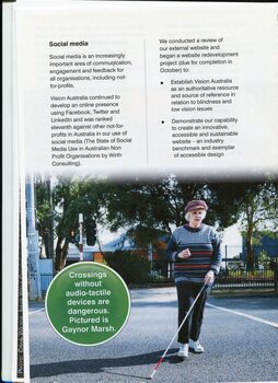 Older woman using a white cane to cross at a crossing, which may not have audio-tactile devices