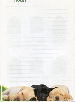 Lined page for note taking and picture of three sleeping puppies at the base