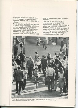 Overview of Day centres. Woman crossing outside Flinders Street station using a white cane amongst a crowd of people