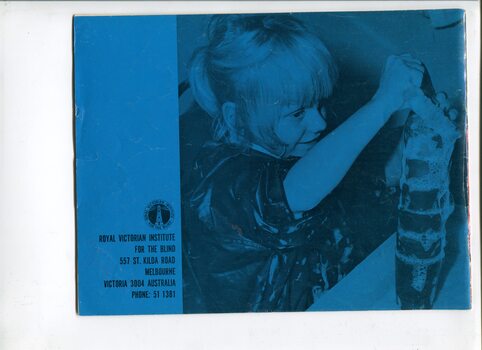 Picture of a girl playing with a stack of cups and soapy water